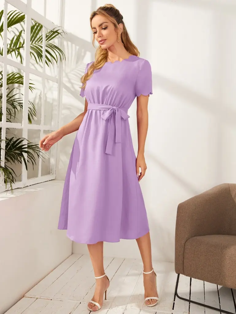 Woman modeling a lavender colored dress