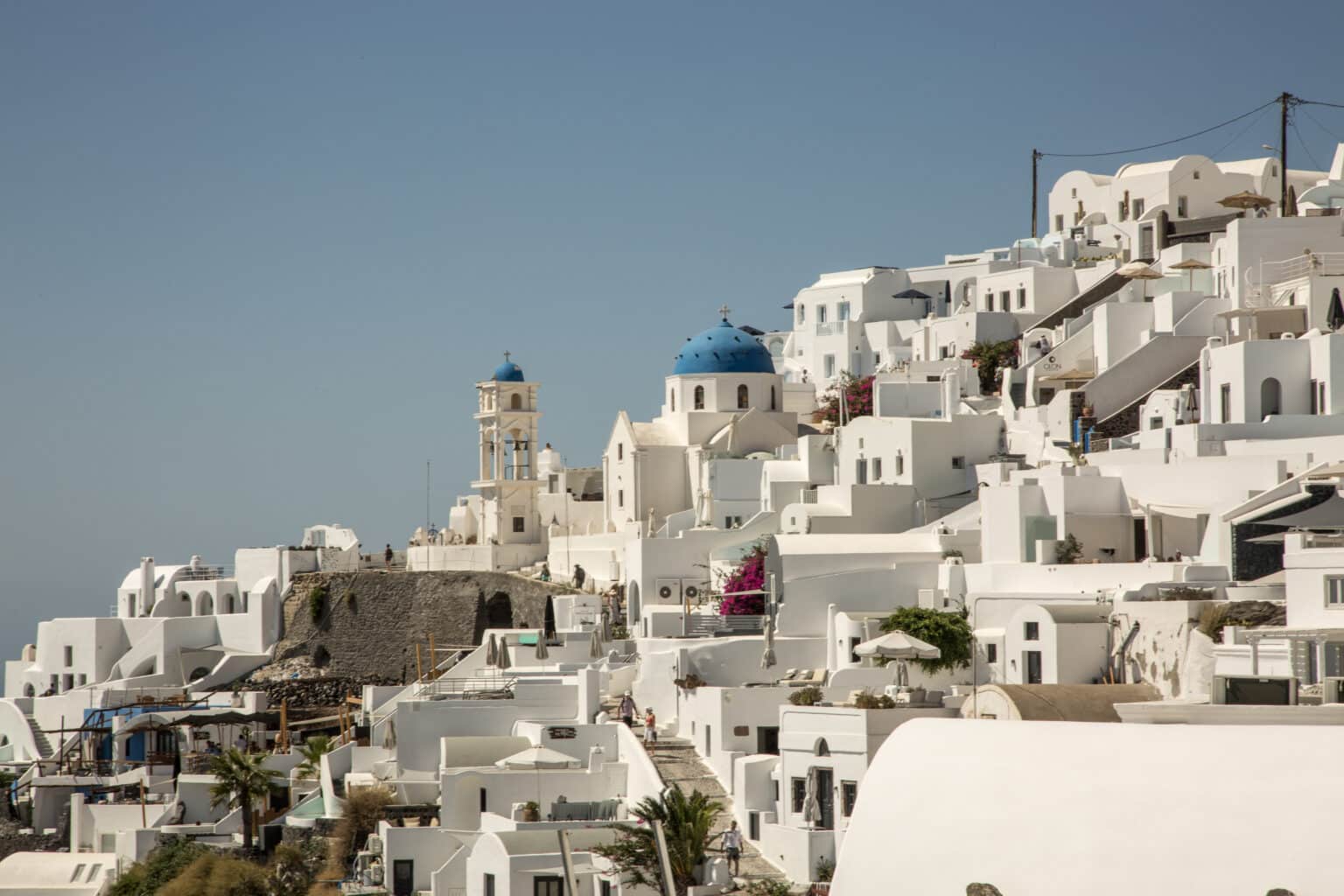 Blue domed churches and white buildings of Santorini greece