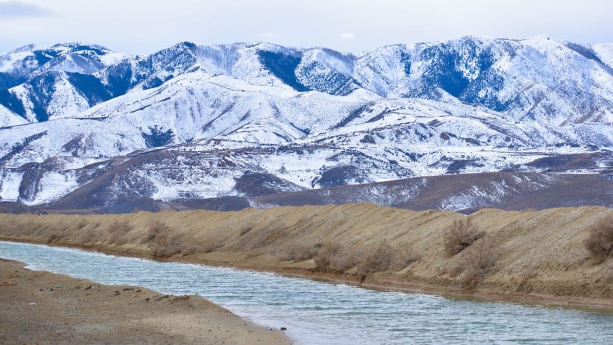 Grantsville, Utah / U.S.A. - February 2nd 2019: View of snow covered mountains with Great Salt Lake waters in forefront on a Saturday morning