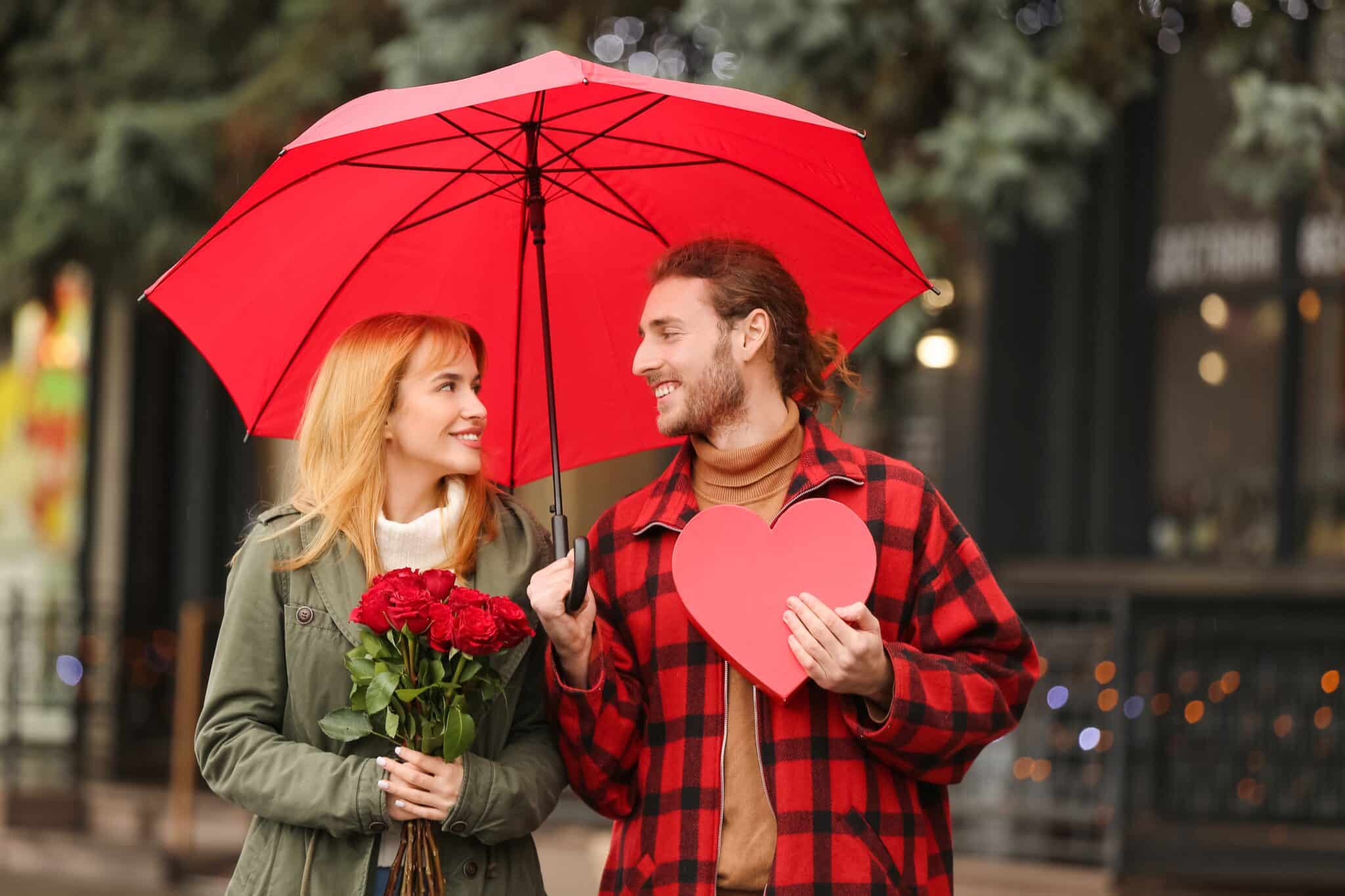 Happy,Young,Couple,Walking,In,City,On,Valentine's,Day