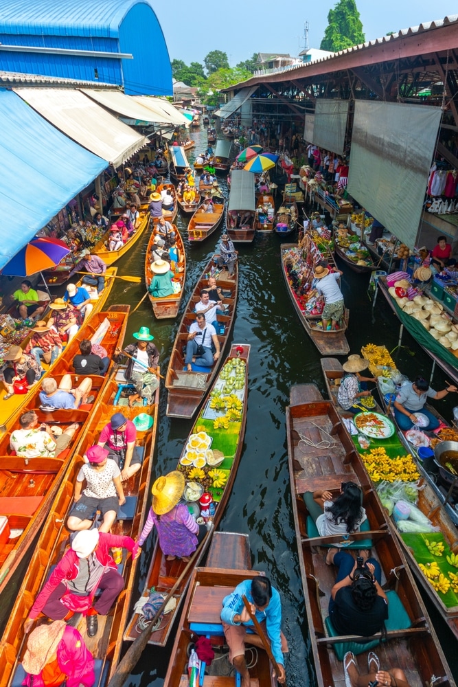 Bangkok, Thailand  15 10 2014 Bangkok floating market local food Thai vendors selling fruits fantastic beautiful place in Thailand