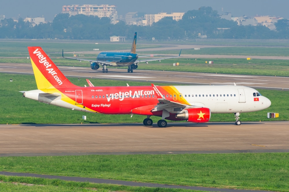 Ho Chi Minh City, Vietnam - August 18, 2024: Vietjet Air A320-200 lining up runway before departure from Tan Son Nhat International Airport.