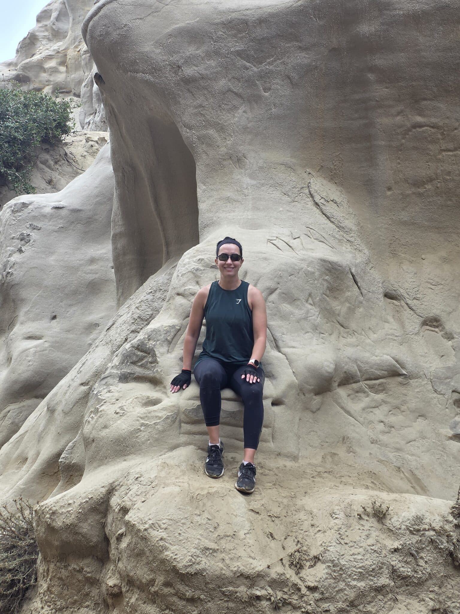 Lindsey sitting on a rock in Torrey Pines