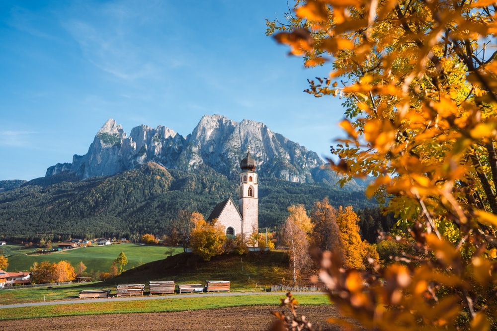 Bright photo of St. Constantine church in Dolomites, Trentino Alto Adige Italy