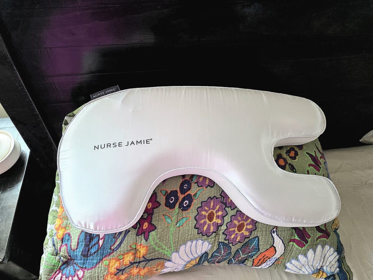 the Nurse Jamie Beauty Bear Memory Foam Pillow stacked on top of a regular pillow