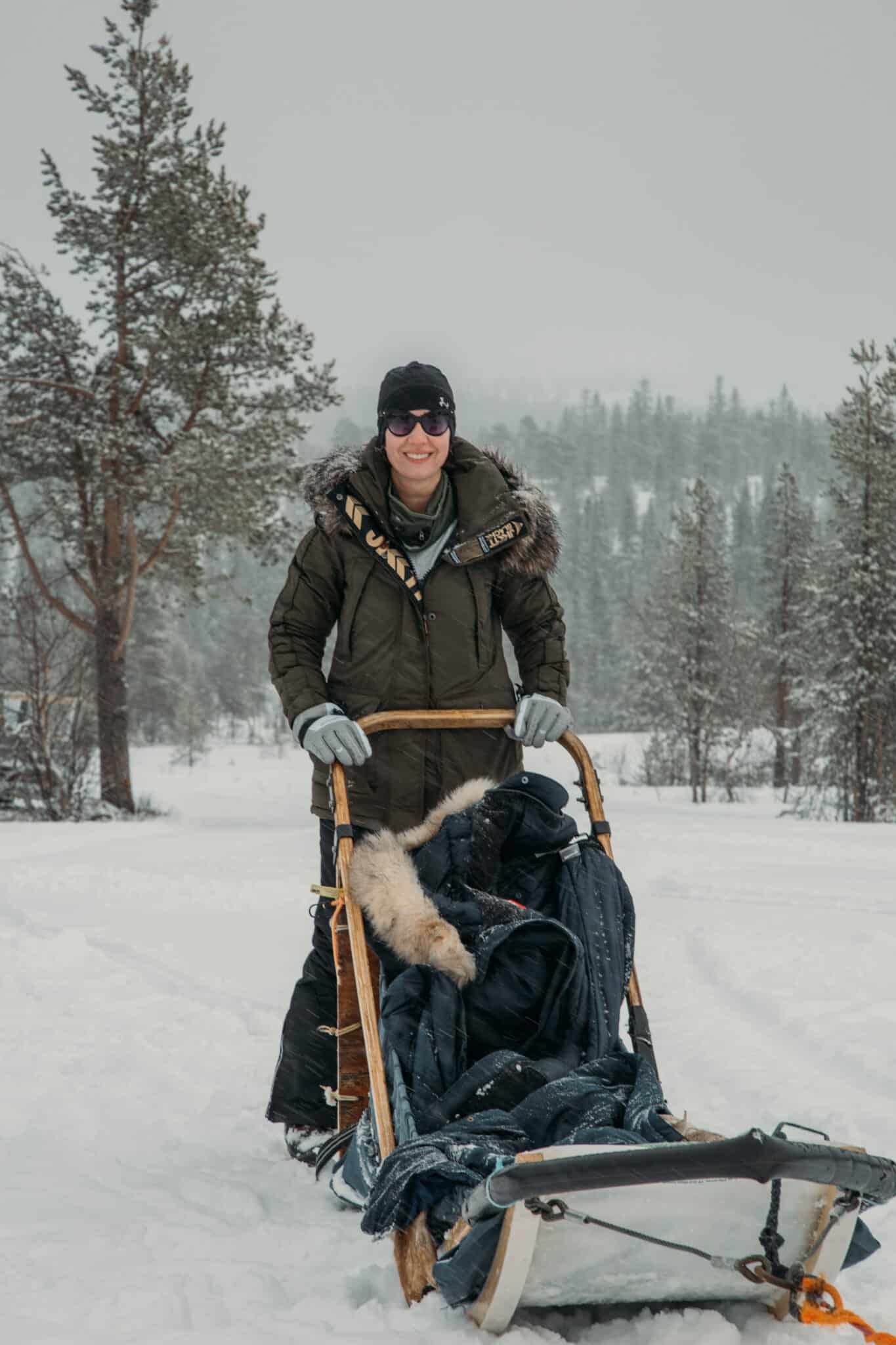 Lindsey of Have Clothes, Will Travel dog sledding in Dalarna Sweden