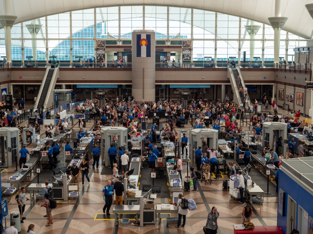 Denver, CO July 7, 2018: Large line of travelers backed up at security checkpoint at Denver International Airport