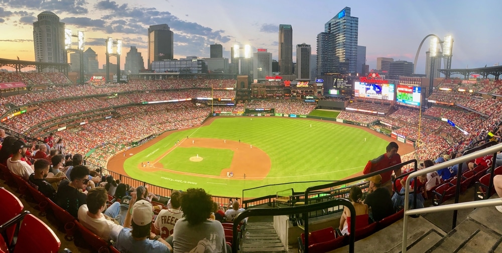 Saint Louis Missouri, United States - July 13, 2024 - Photo of the St Louis Cardinals stadium during a summer game around sunset, with the skyline of the city in the background