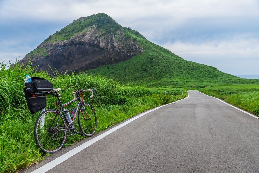 Niigata, Japan - August 12, 2014: Travel by the bicycle on the Sado island. Sado Island lies off the coast of Niigata Prefecture, and is one of Japan's largest islands.