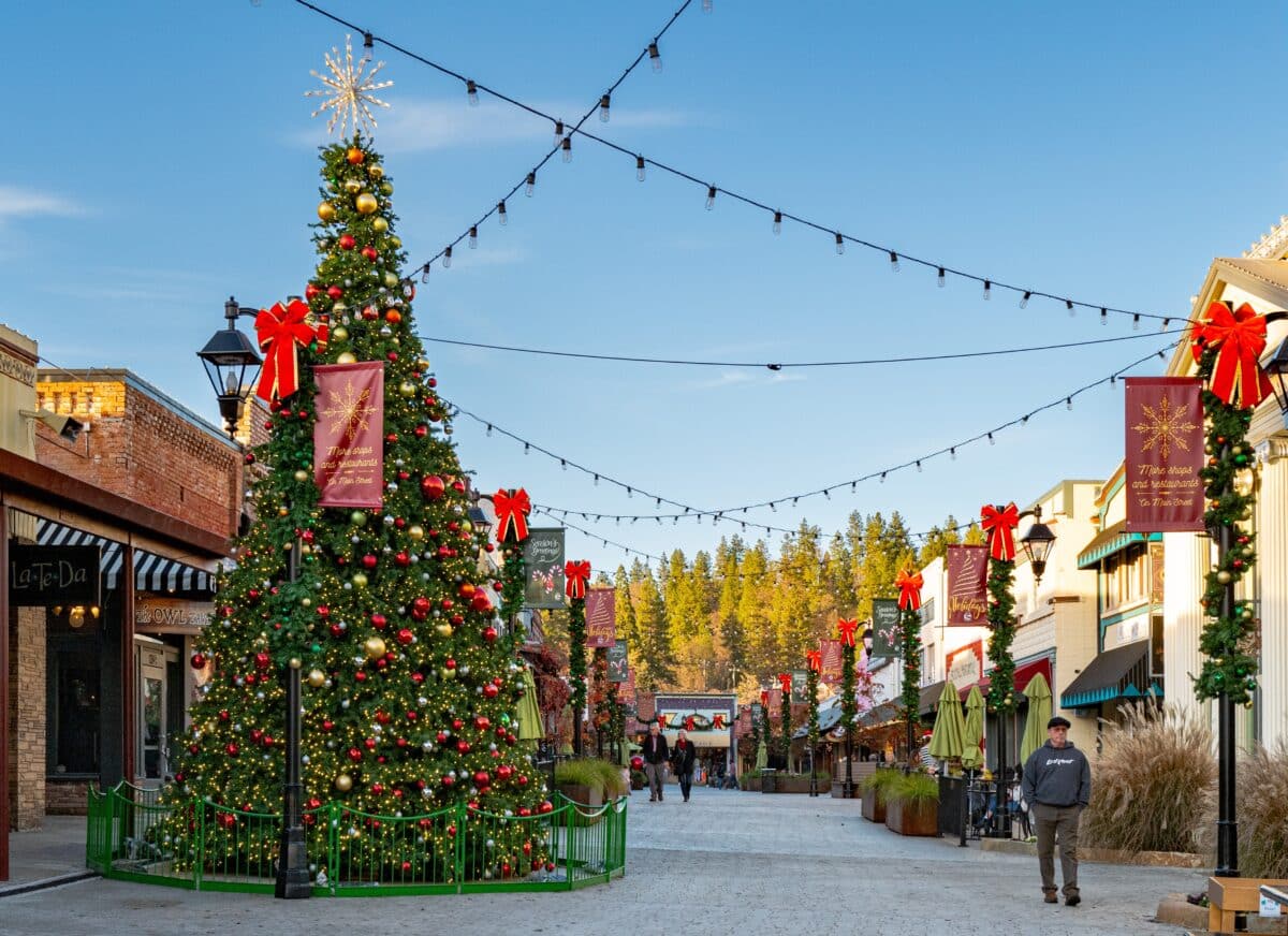 Grass Valley, CA, U.S.A. - Dec. 18, 2024: Photo of the Mill Street pedestrian shopping area decorated for Christmas in the city's historic old town area.