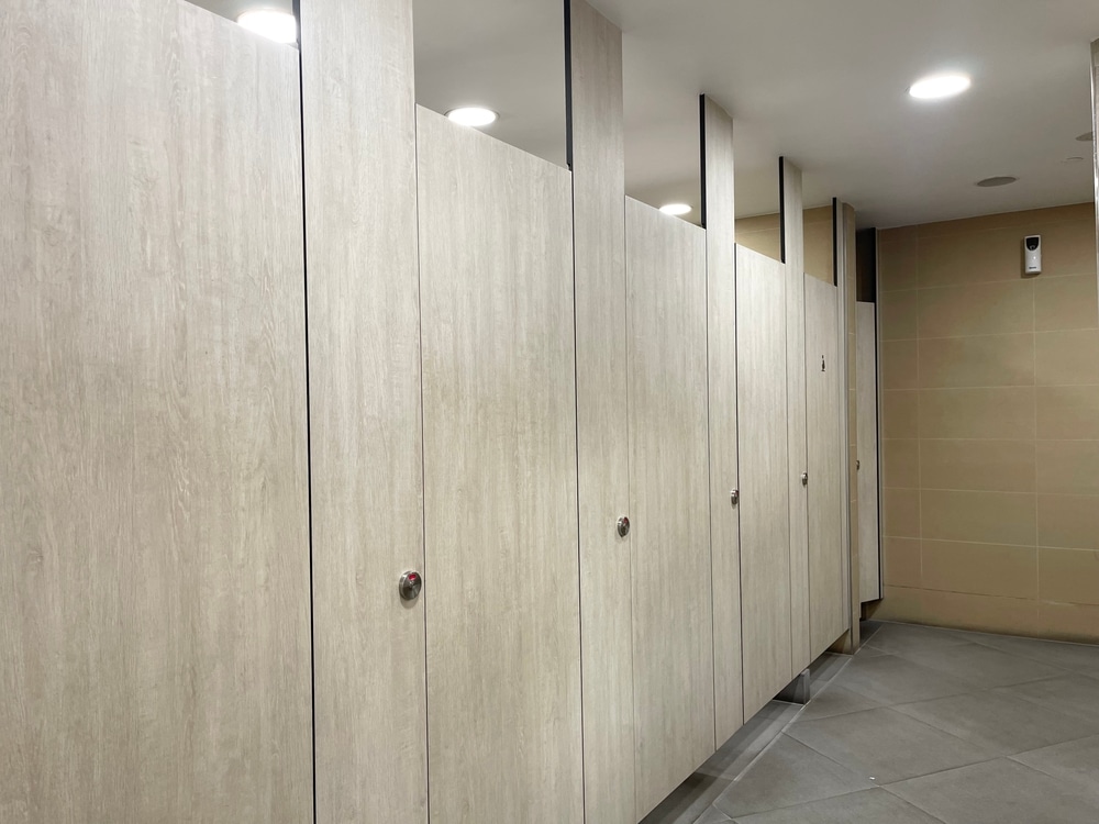 Row of public toilet decoration with wooden partition and wooden door