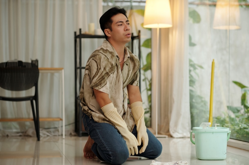 Man Tired Of Housework At Home