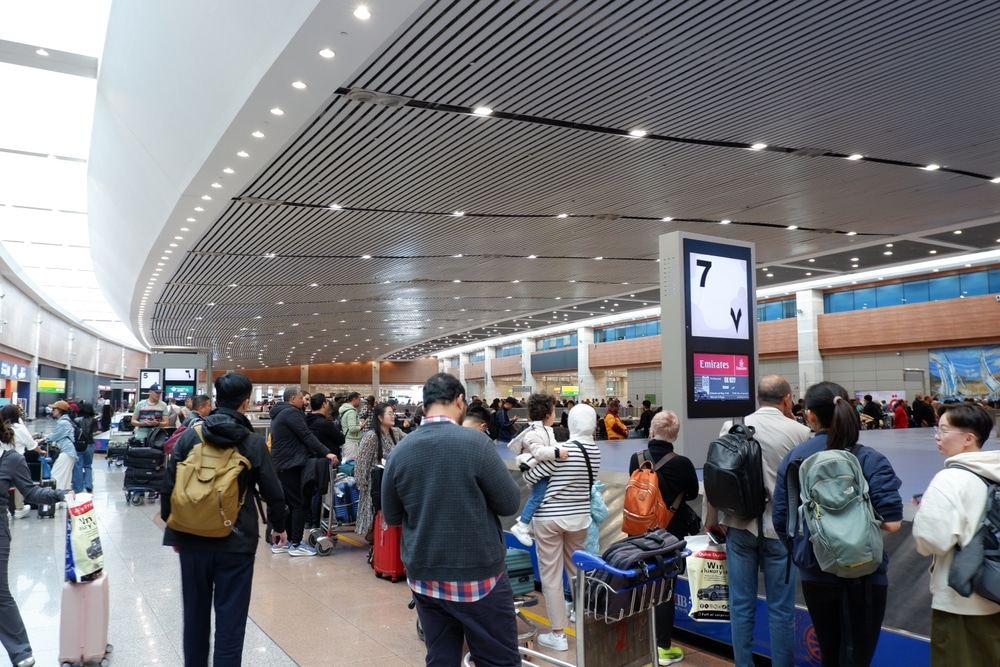 Cairo, Egypt - December 10, 2025: Crowd Waiting for Luggage at Cairo International Airport Terminal