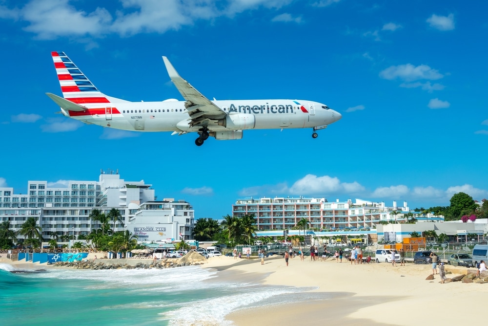 MAHO BEACH, SINT MAARTEN - JANUARY 11: American airlines Boeing airplane landing in Princess Juliana International Airport (SXM) and Maho beach, on January 11, 2025 iSint Maarten island (Saint Martin)
