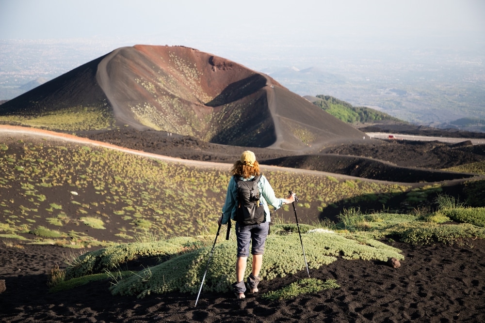 hiker trekking on mount Etna