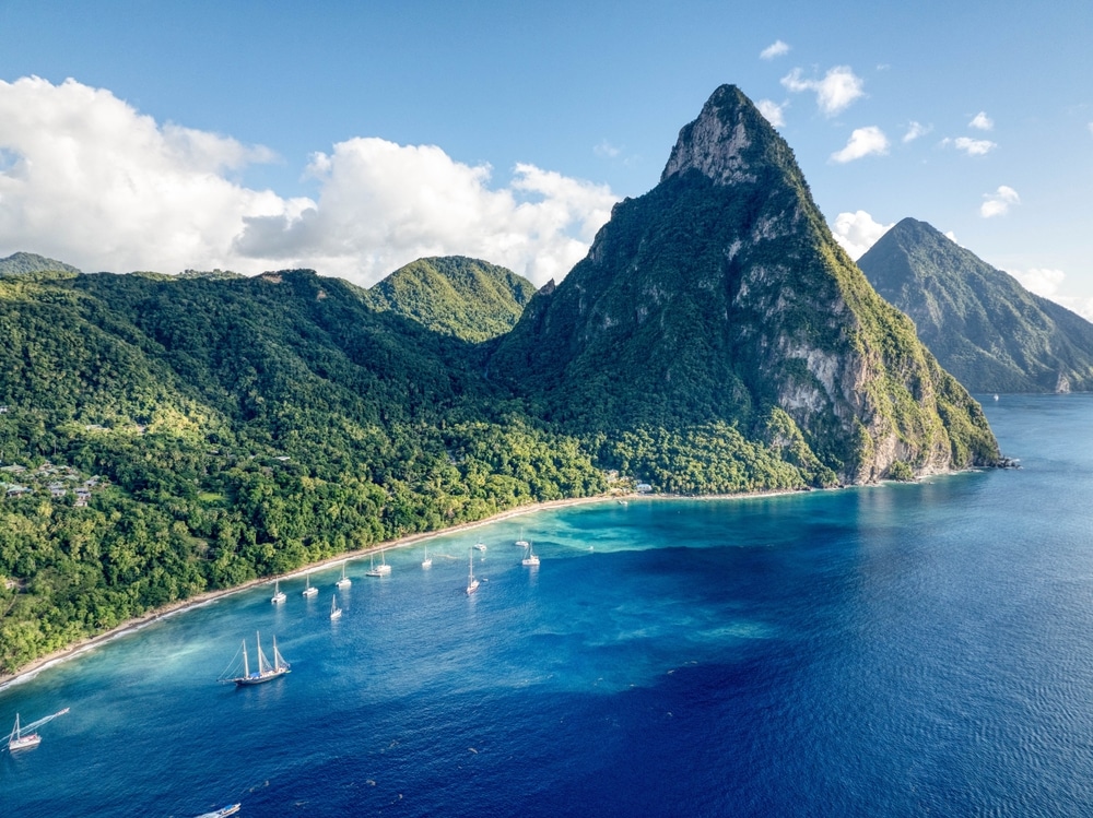 Aerial view of yachts anchored in front of the Gros Piton mountain peak in Soufriere, Saint Lucia