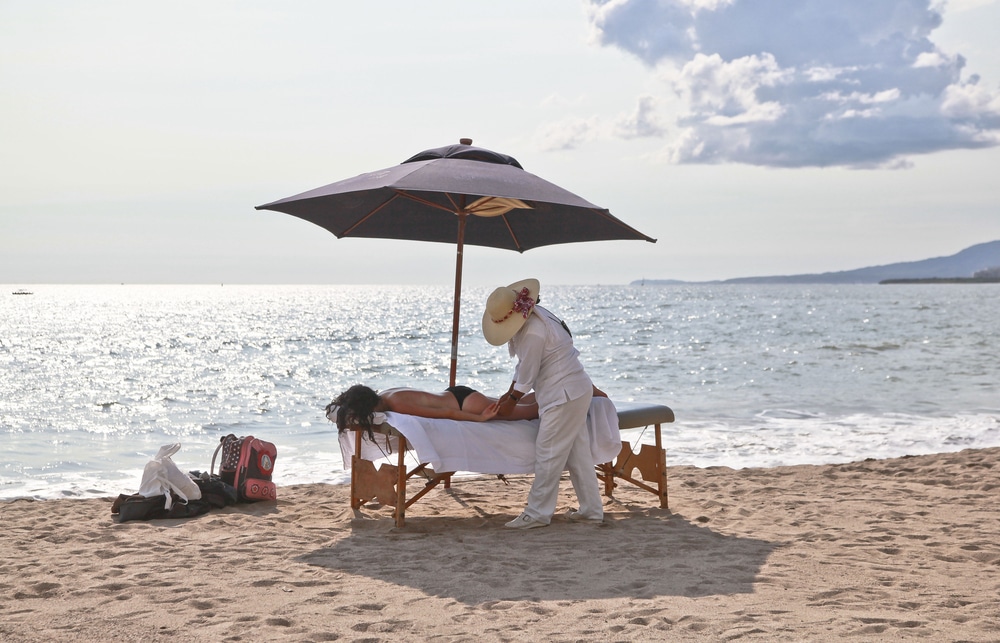 massage therapist on the beach