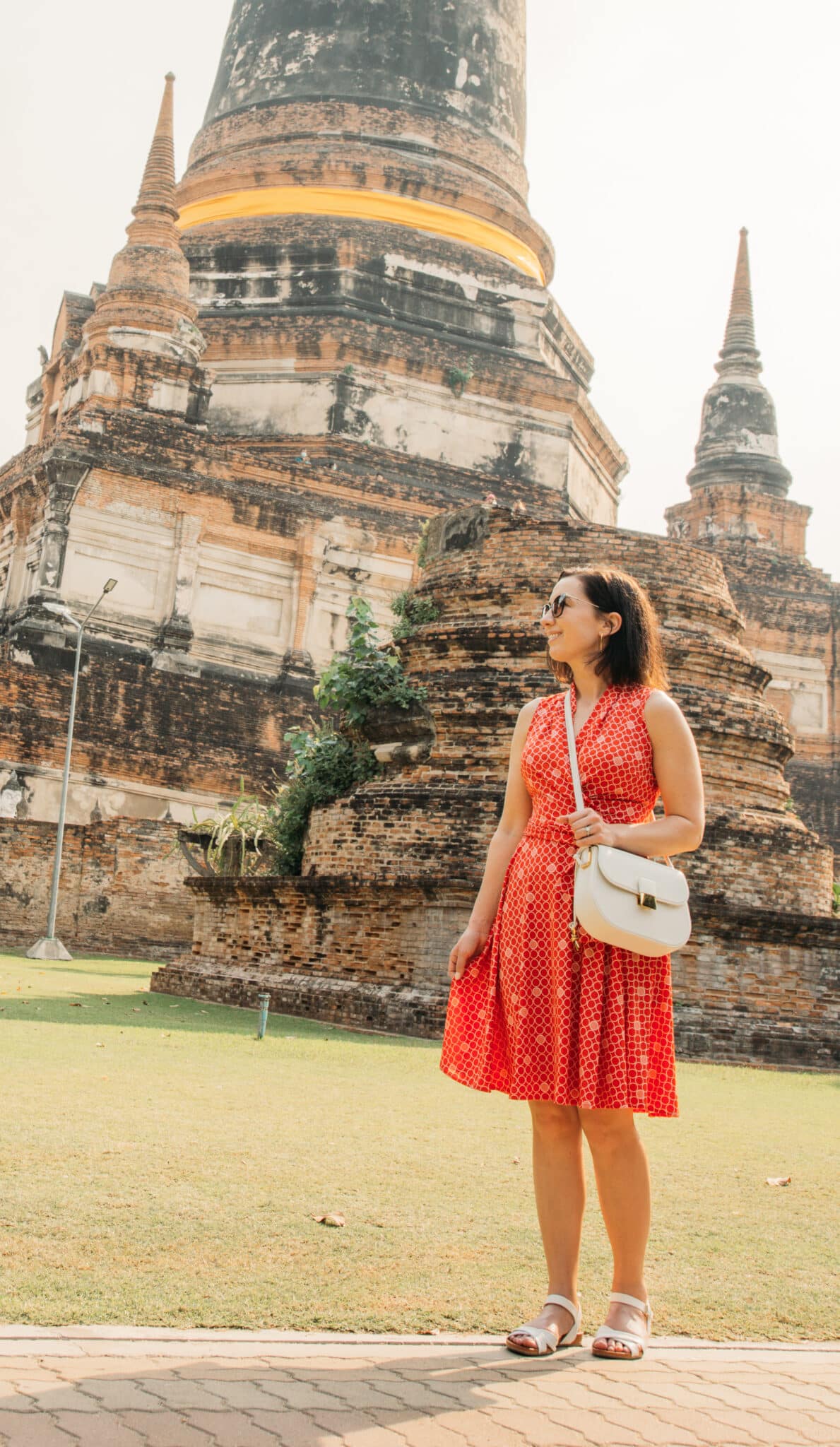Lindsey wearing a Karina dress and white cross body bag in Bangkok Thailand