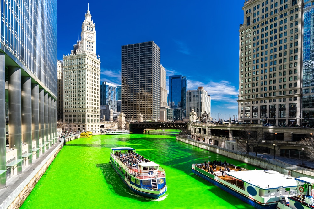 Chicago Skylines building along green dyeing river of Chicago River on St. Patrick's day festival in Chicago Downtown IL USA