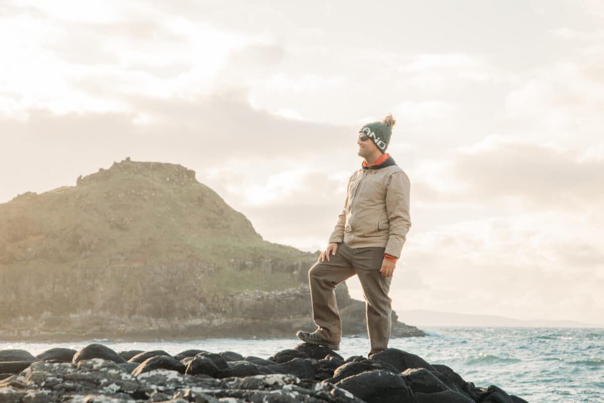 Zac wearing his hiking shoes and travel jacket.