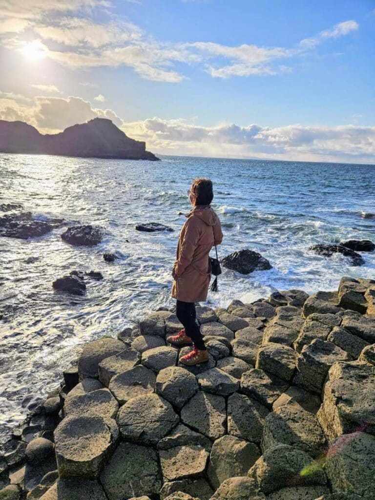 Lindsey in Ireland looking at the water on the Giant's Causeway