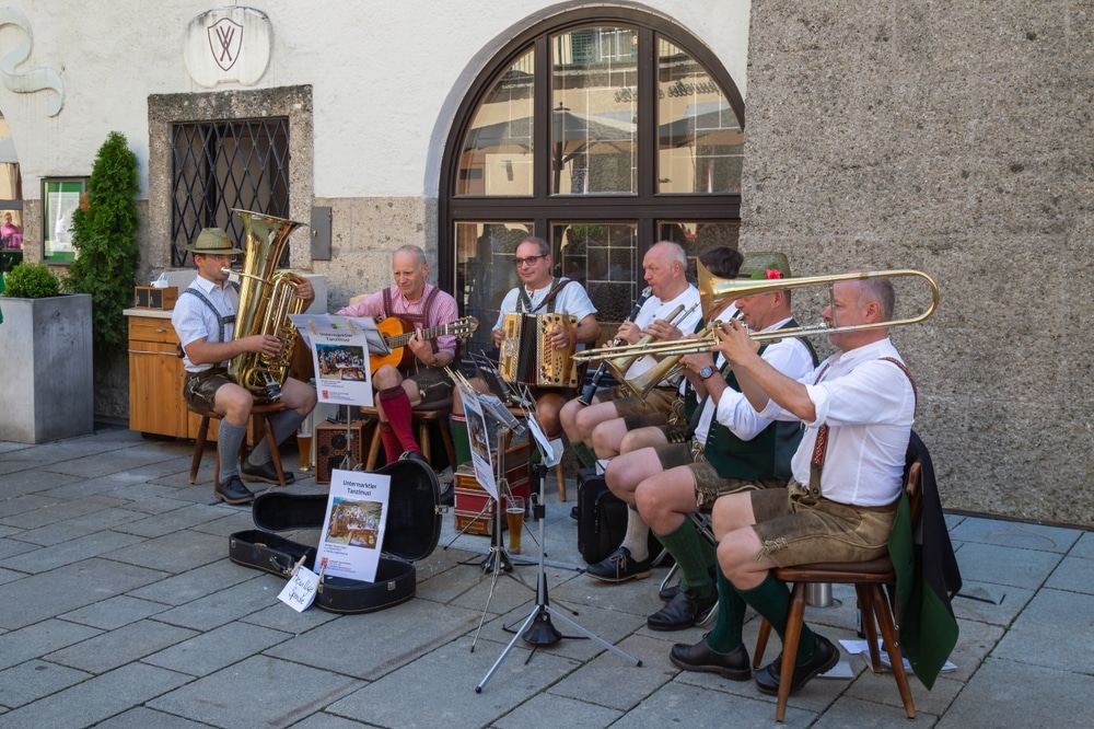 SALZBURG, AUSTRIA - JULY 19, 2025: Austrian traditional music band playing on the street during the summer festival "Salzburg Street Music".