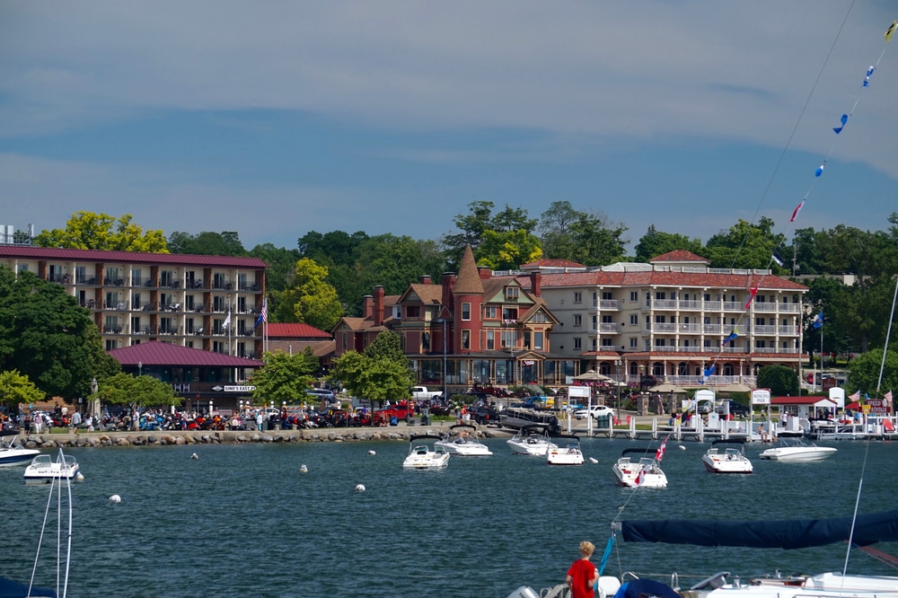 Wisconsin, USA; June 23, 2019: Lakefront hotels in Lake Geneva. A popular tourist destination for summer vacation, its parking lots crowded with visitors and their vehicles.