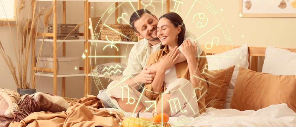 Happy young couple hugging while sitting in bedroom. Love compatibility horoscope. Partner matching by date of birth