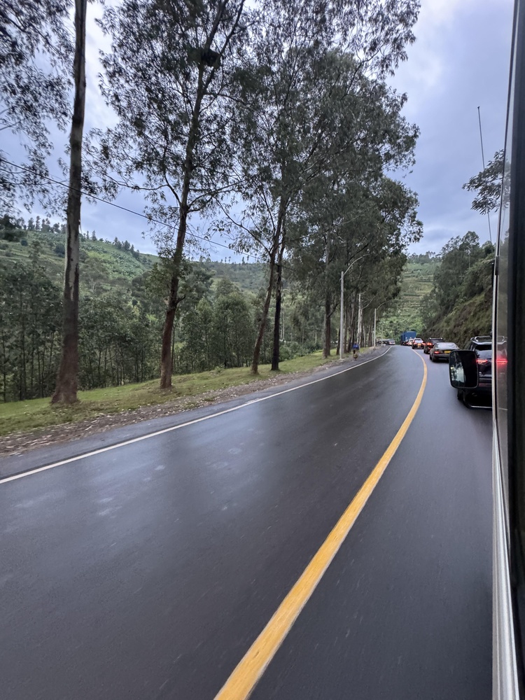 KIGALI, RWANDA – NOVEMBER 30, 2025: A paved countryside road stretches through lush green hills and rural farmland on the outskirts of Kigali, Rwanda, reflecting the country’s natural landscape and developing infrastructure.
