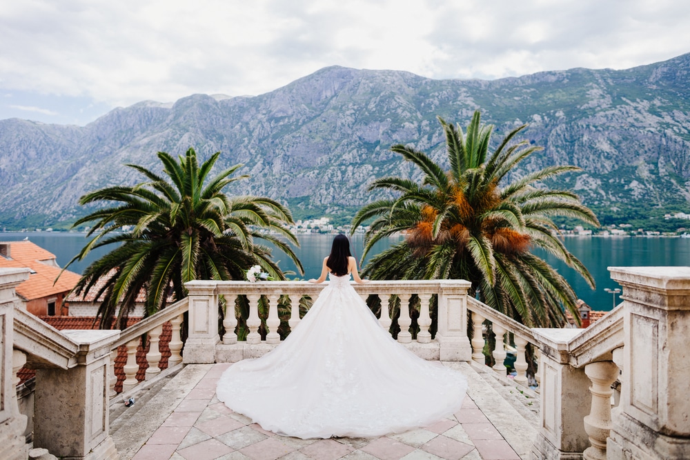 bride in wedding dress in beautiful location. Back view. Destination wedding