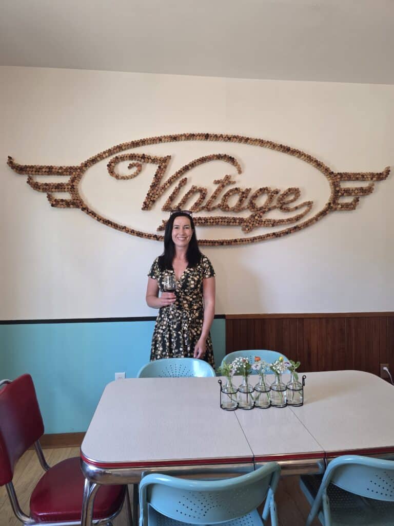 Lindsey of Have Clothes, Will Travel doing a wine tasting at Vintage Elkhart Lake