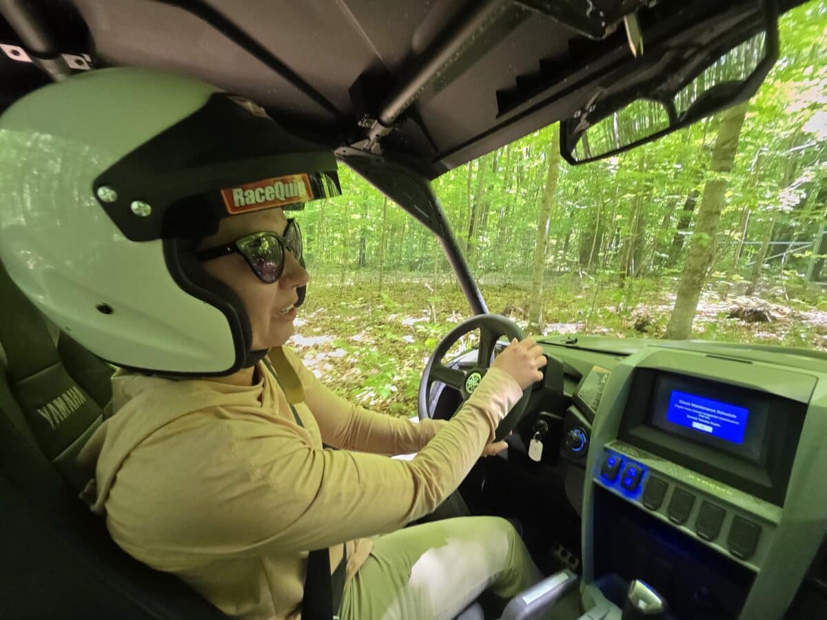Lindsey driving a UTV at Road America