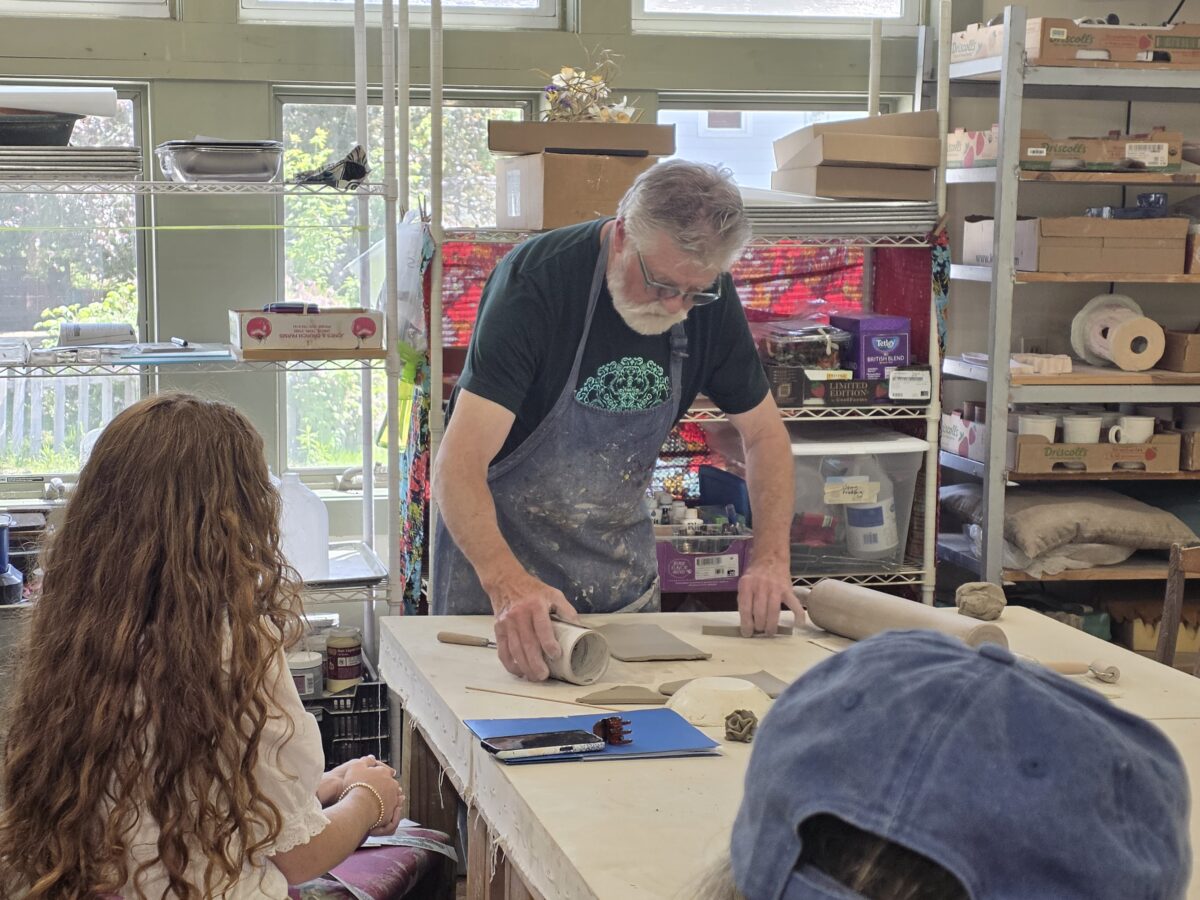 Pat of Two Fish Gallery teaching a pottery class in Elkhart Lake, Wisconsin