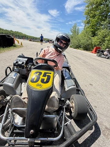 Lindsey of Have Clothes, Will Travel driving a go-kart at Road America