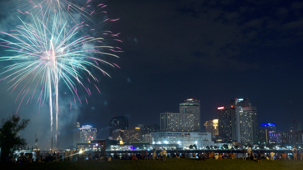 Fourth of July 2018 Fireworks show in New Orleans, LA with the city skyline in the background across the Mississippi River.