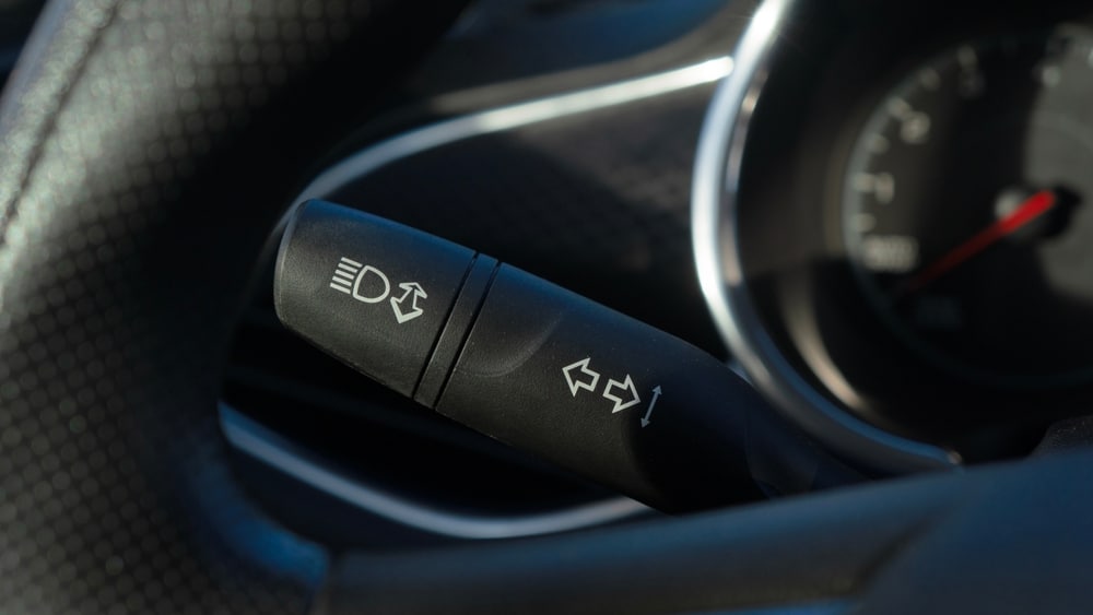 Turn signal lever, adjusting car headlight control switch