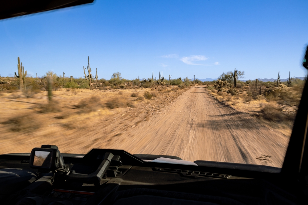 Speeding through the desert near Gila River in a UTV east of Phoenix, Arizona, USA