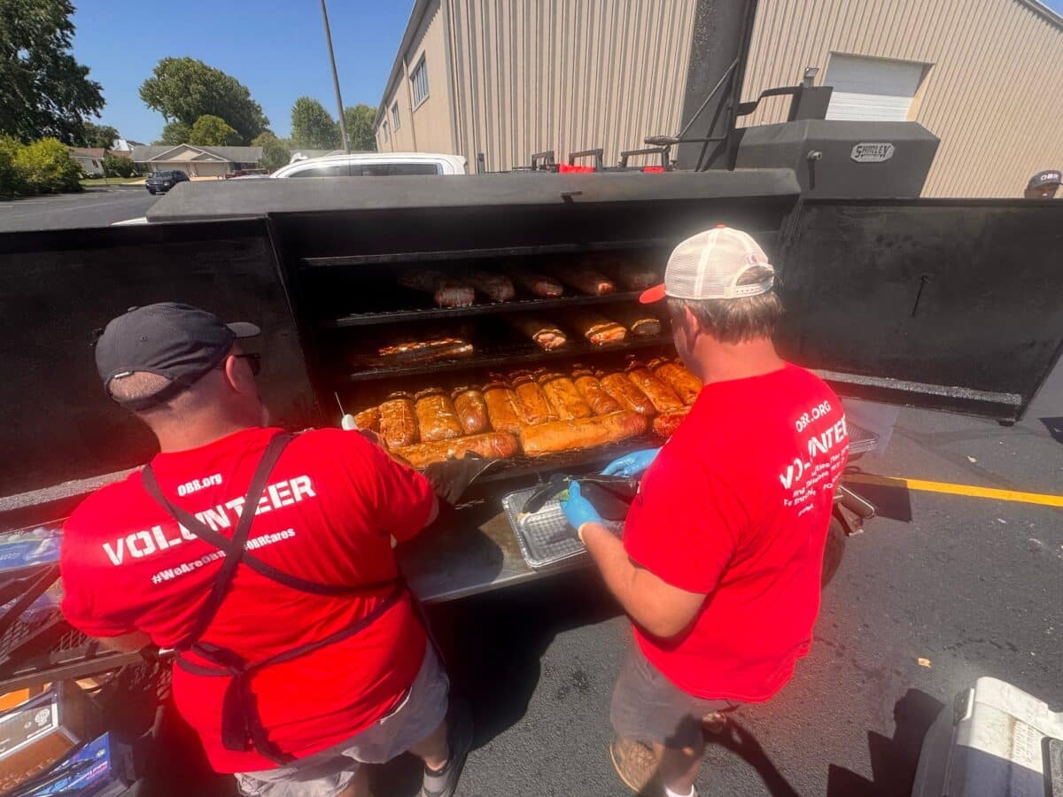 Operation BBQ Relief volunteers tend the smokers as they prepare meals for first responders, cleanup crews and families affected by the July 27 tornado in Menasha.