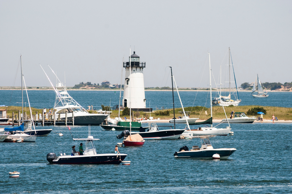 Edgartown Lighthouse on Martha's Vineyard with harbor boats