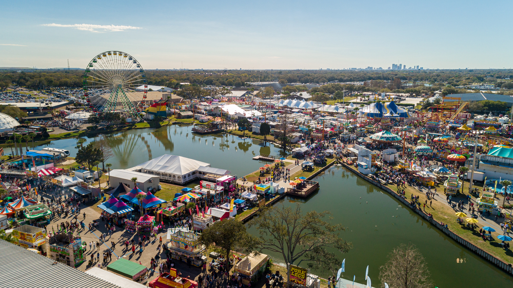 "Tampa, FL / USA - 2-8-2020: Drone View of the Heart of the Florida State Fair With Rollercoasters and People Walking Around."