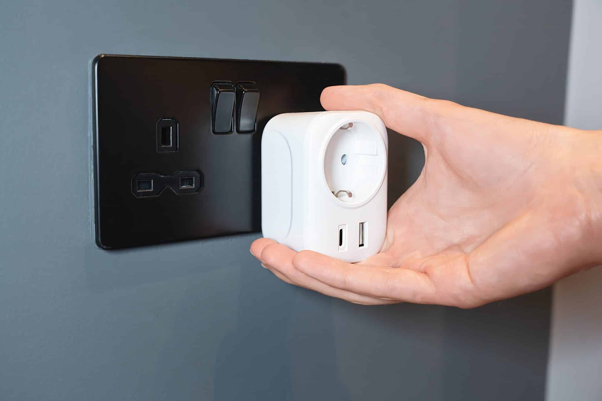 Hand,Holding,A,Smart,Power,Eu,Adapter,With,Usb,Ports